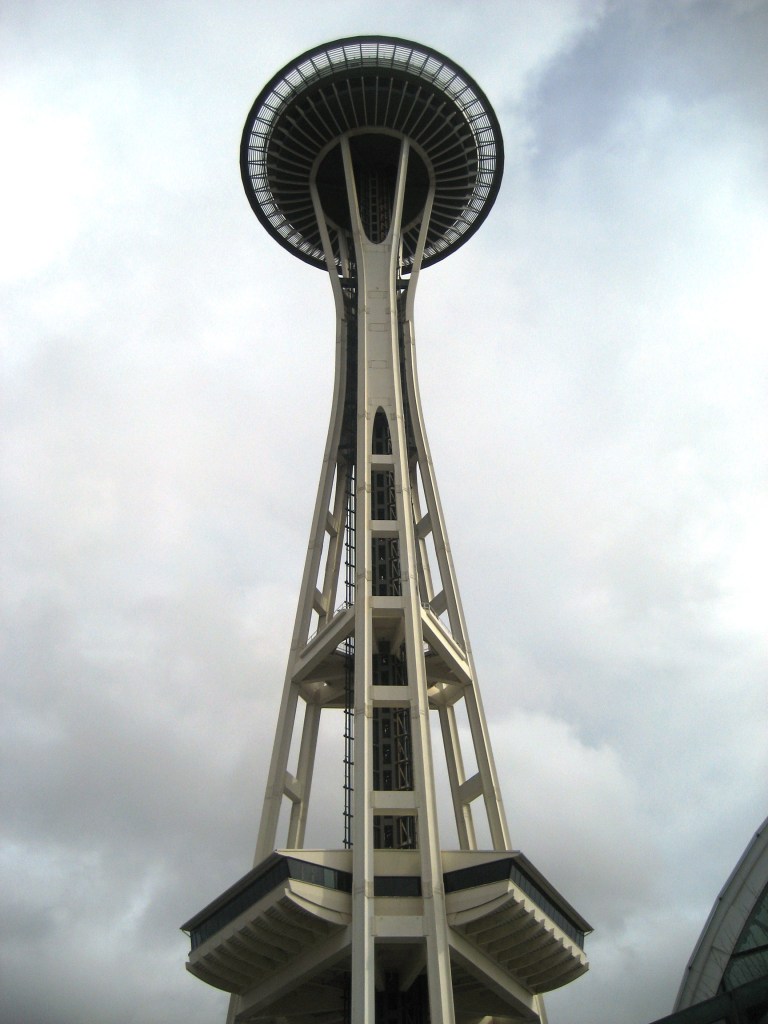 The Seattle Space Needle as seen by the Chihuly Exhibit on a cloudy day.