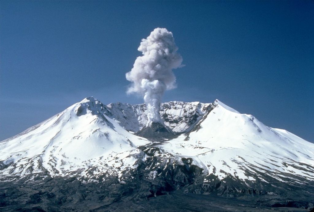 Mount St. Helens, years after its 1980 eruption on May 18thh.
A plume of smoke can be seen rising from the new dome from within.