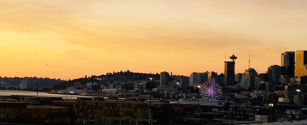 Seattle skyline with the Great Wheel and Space Needle in view.